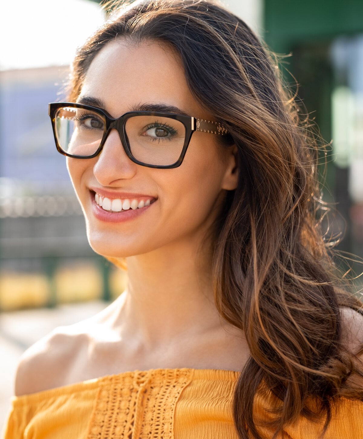 new jersey cosmetic dentistry model with brown hair and glasses smiling