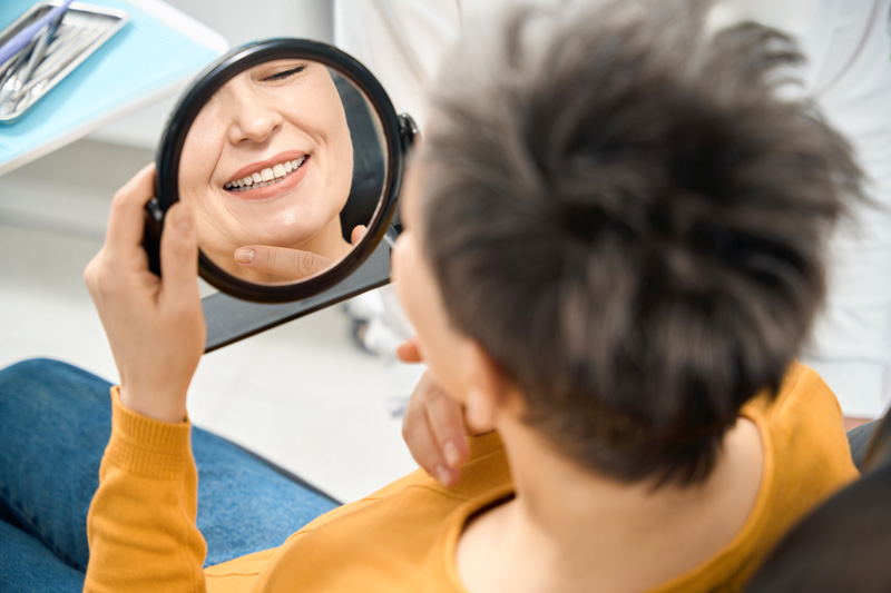 Woman checking her smile